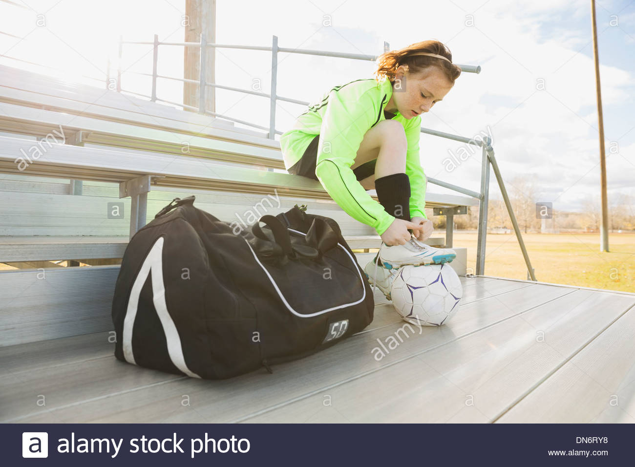 Girl tying soccer cleats Stock Photo Alamy