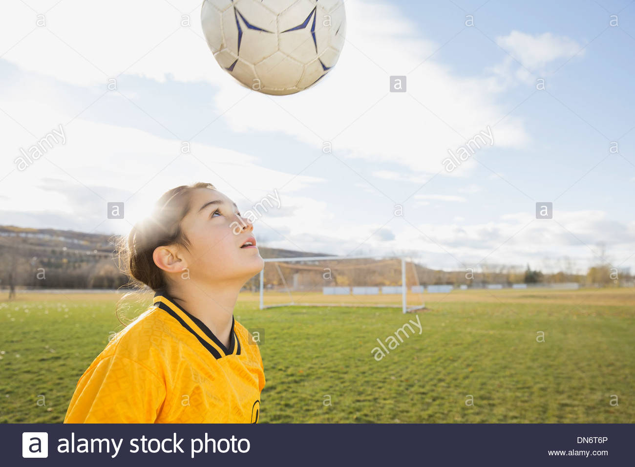 Soccer player juggling soccer ball Stock Photo Alamy