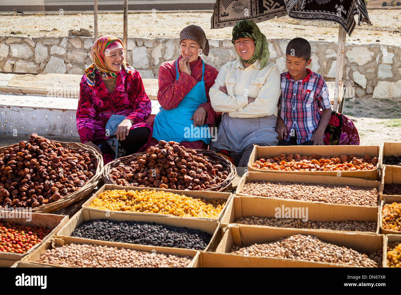 Women selling food in an outdoor market, near Samarkand, Uzbekistan Stock Photo