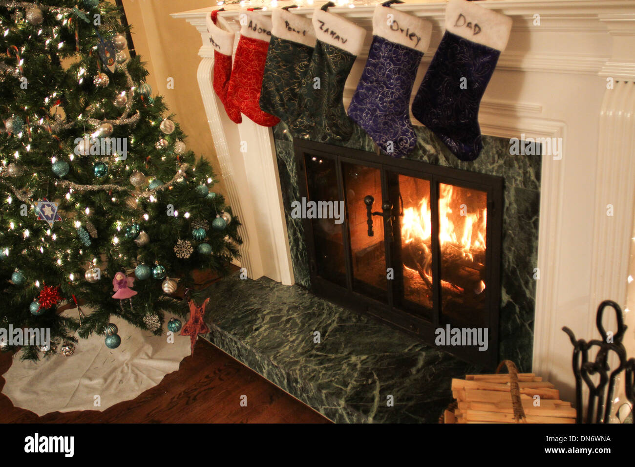 Stockings hung over the fireplace during Christmas Stock Photo Alamy
