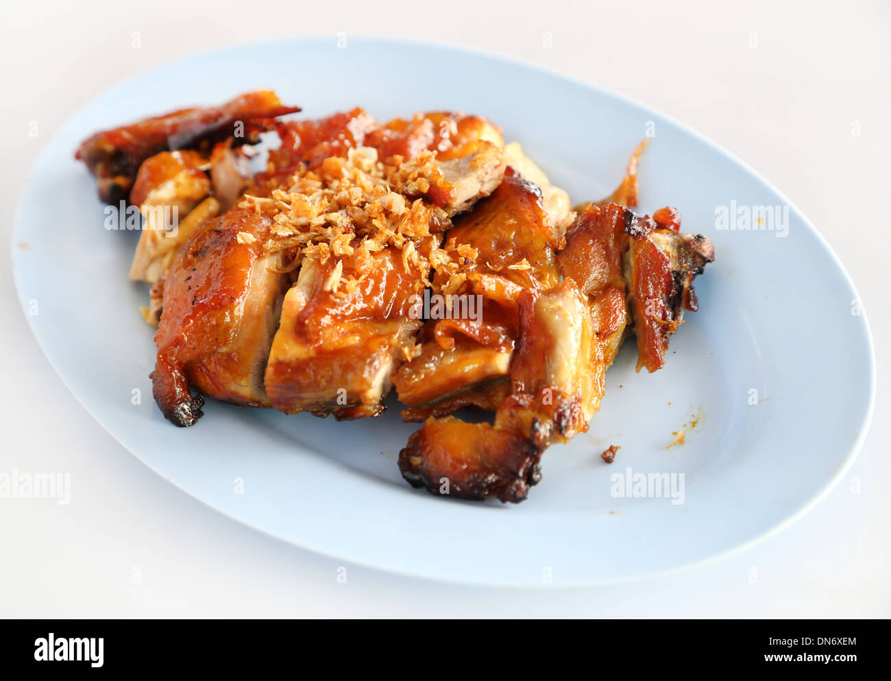 roasted chicken thai style on white table Stock Photo
