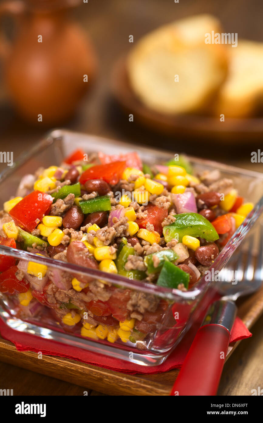 Chili con carne salad made of mincemeat, kidney beans, green bell
