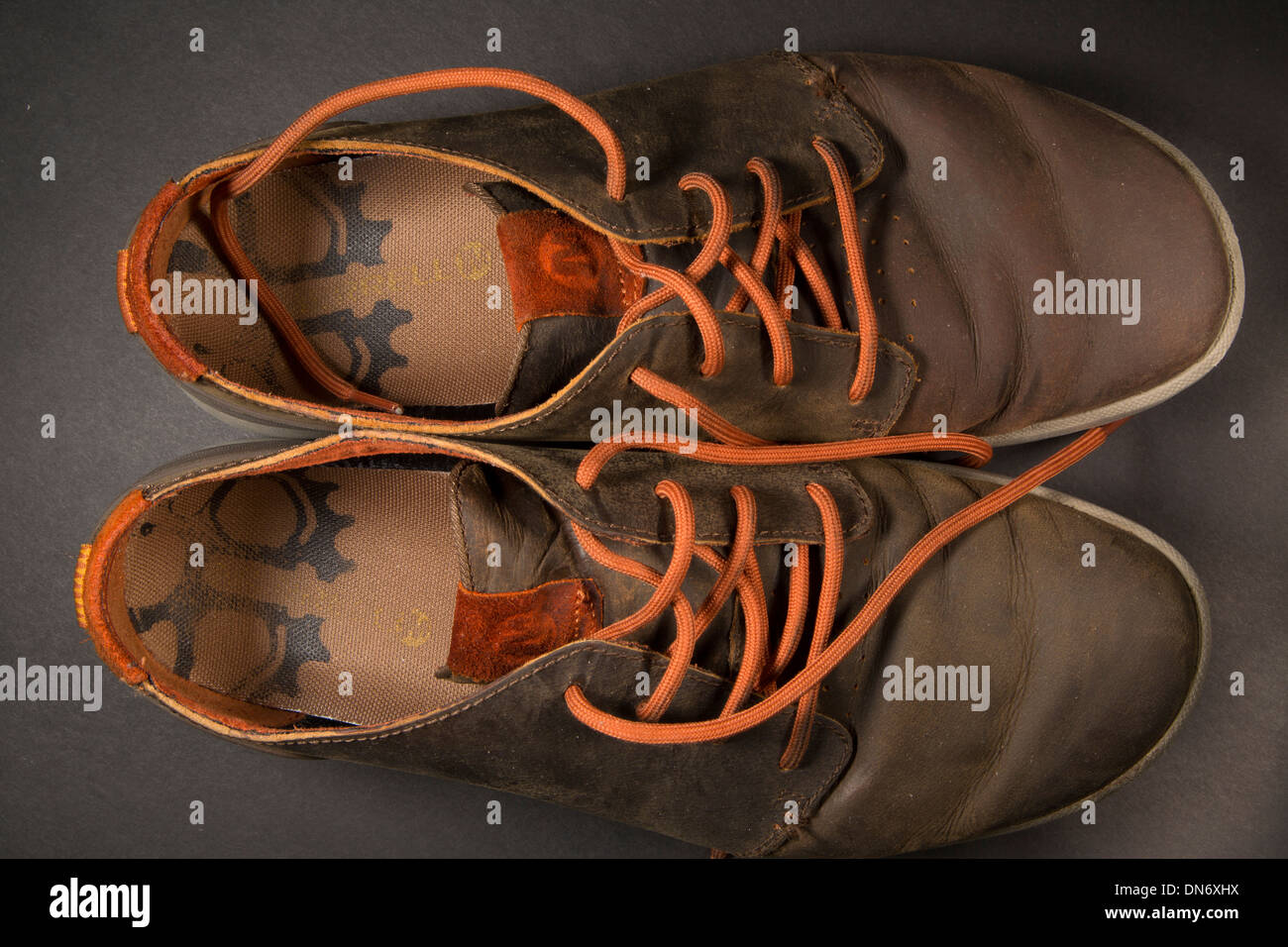 Pair of comfortable Merrell shoes, brown with orange laces Stock Photo -  Alamy