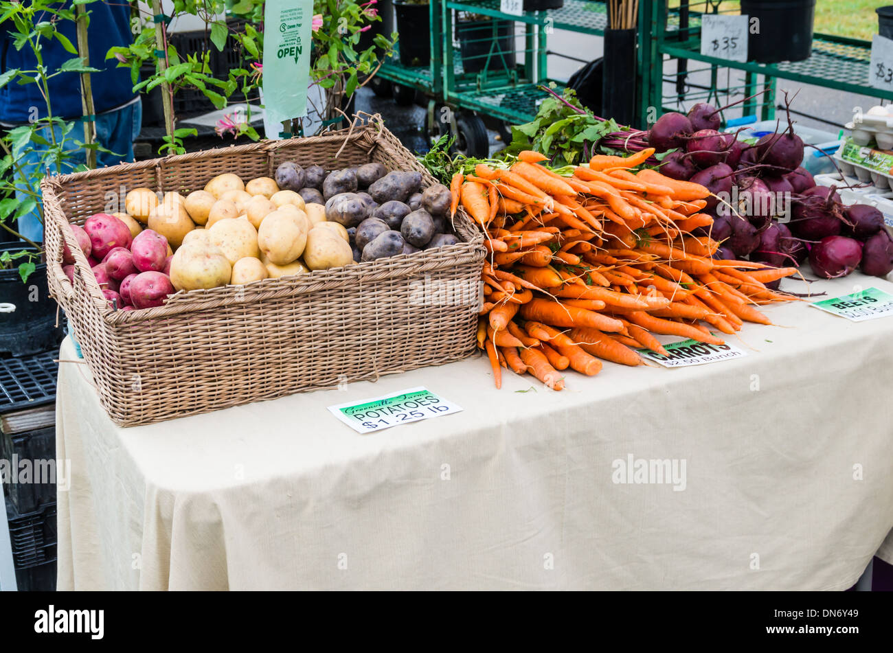 Display of fresh vegetables carrots beets and potatoes at a farmers market.  Beaverton, Oregon Stock Photo