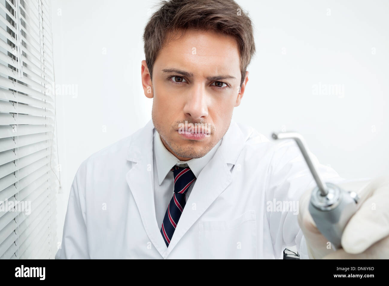 Dentist Holding Water Spraying Tool Stock Photo Alamy