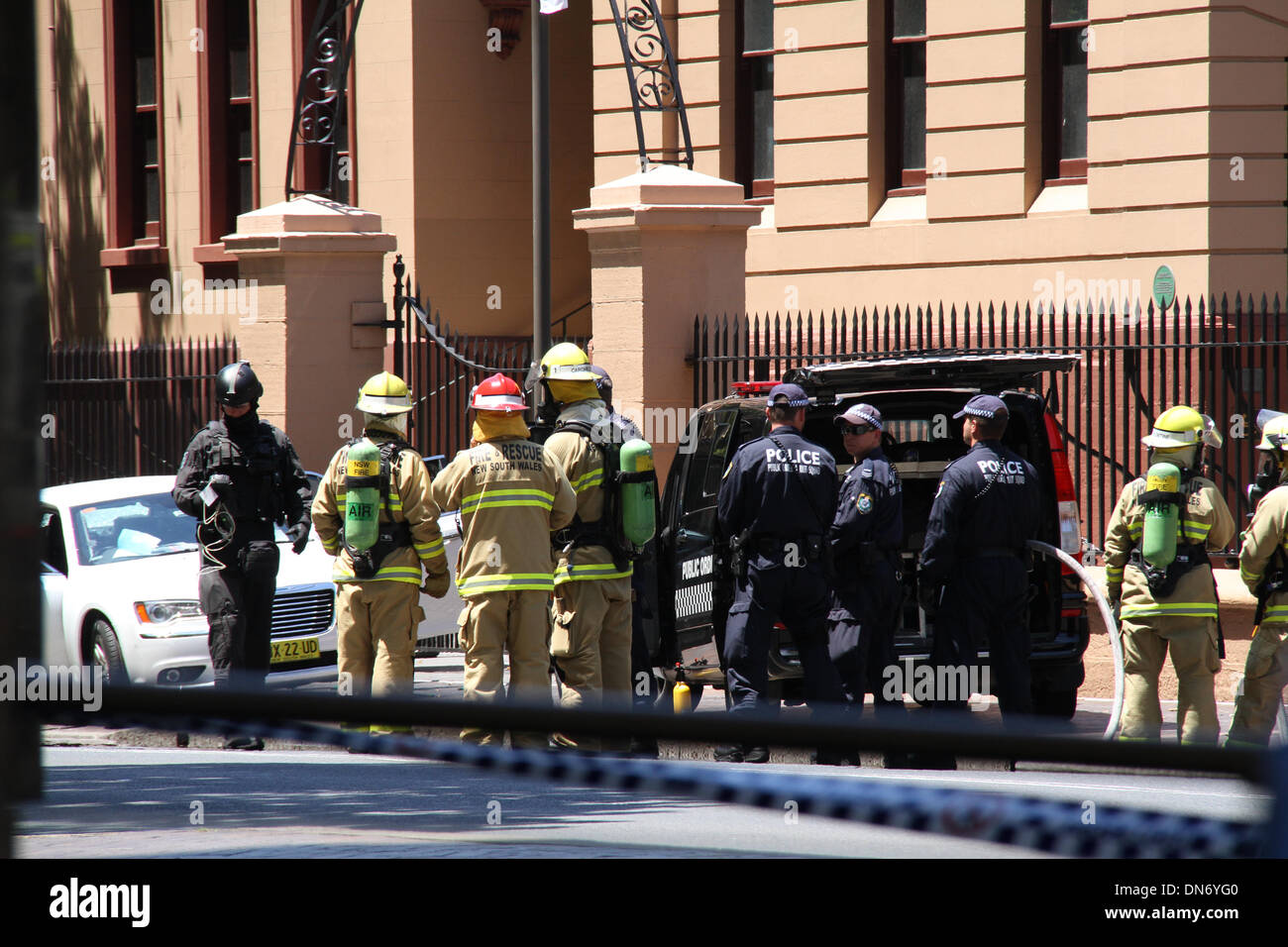 Macquarie Street, Sydney NSW 2000, Australia. 20 December 2013. Police and Fire & Rescue attend to the incident involving a man in a white car outside the NSW Parliament on Macquarie Street, Sydney. Copyright Credit:  2013 Richard Milnes/Alamy Live News Stock Photo