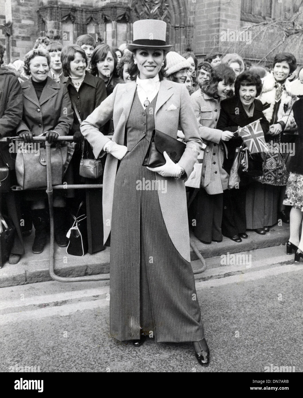 Mar. 10, 1975 - London, England, U.K. - Actress JOANNA LUMLEY and ex-girlfriend of the groom, stole the show when she arrived wearing a tail-coat and top hat for the wedding of Earl of Lichfield and Lady Leonora Grosvenor. Stock Photo