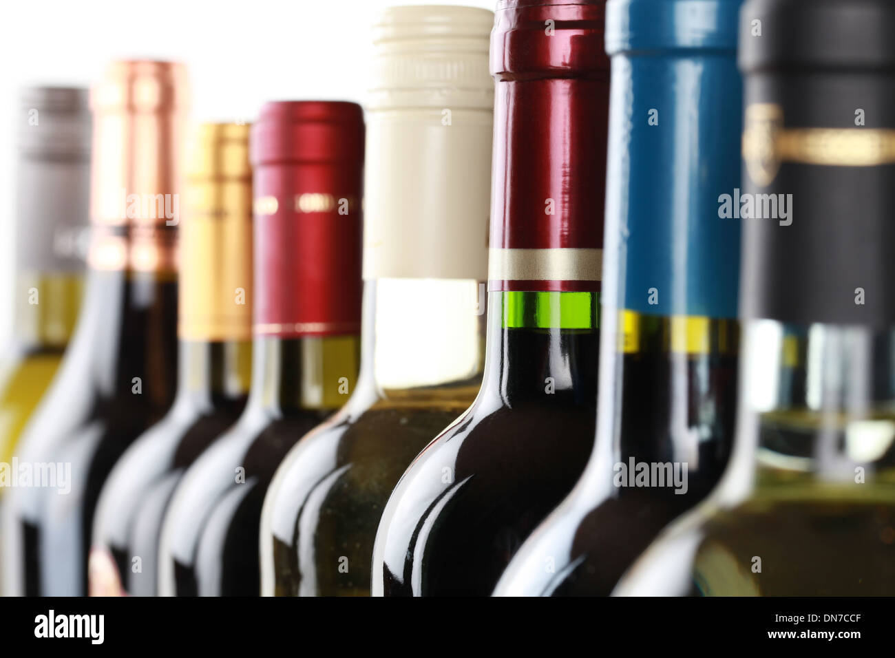 Wine bottles in a row isolated on a white background Stock Photo
