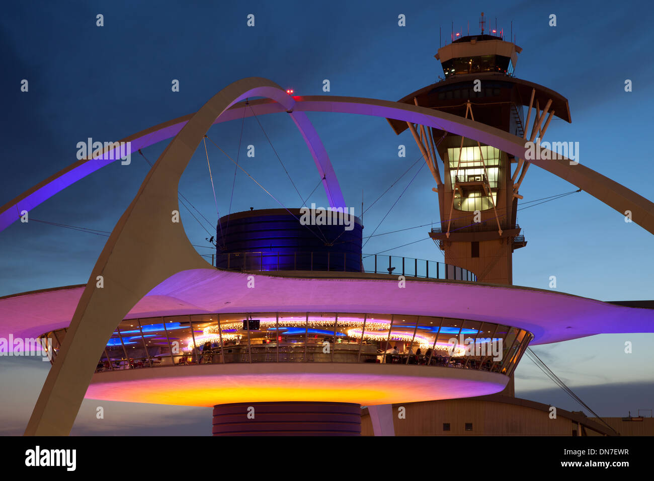 Theme Building and tower of Los Angeles International Airport at dusk Stock Photo