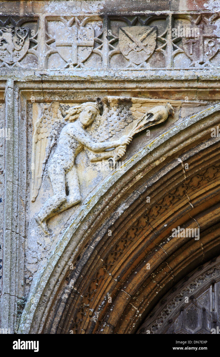 A view of a stone carving in a spandrel at the west door of the parish church at Salle, Norfolk, England, United Kingdom. Stock Photo