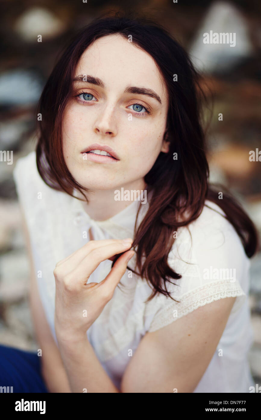 Portrait of young woman looking at camera Stock Photo - Alamy