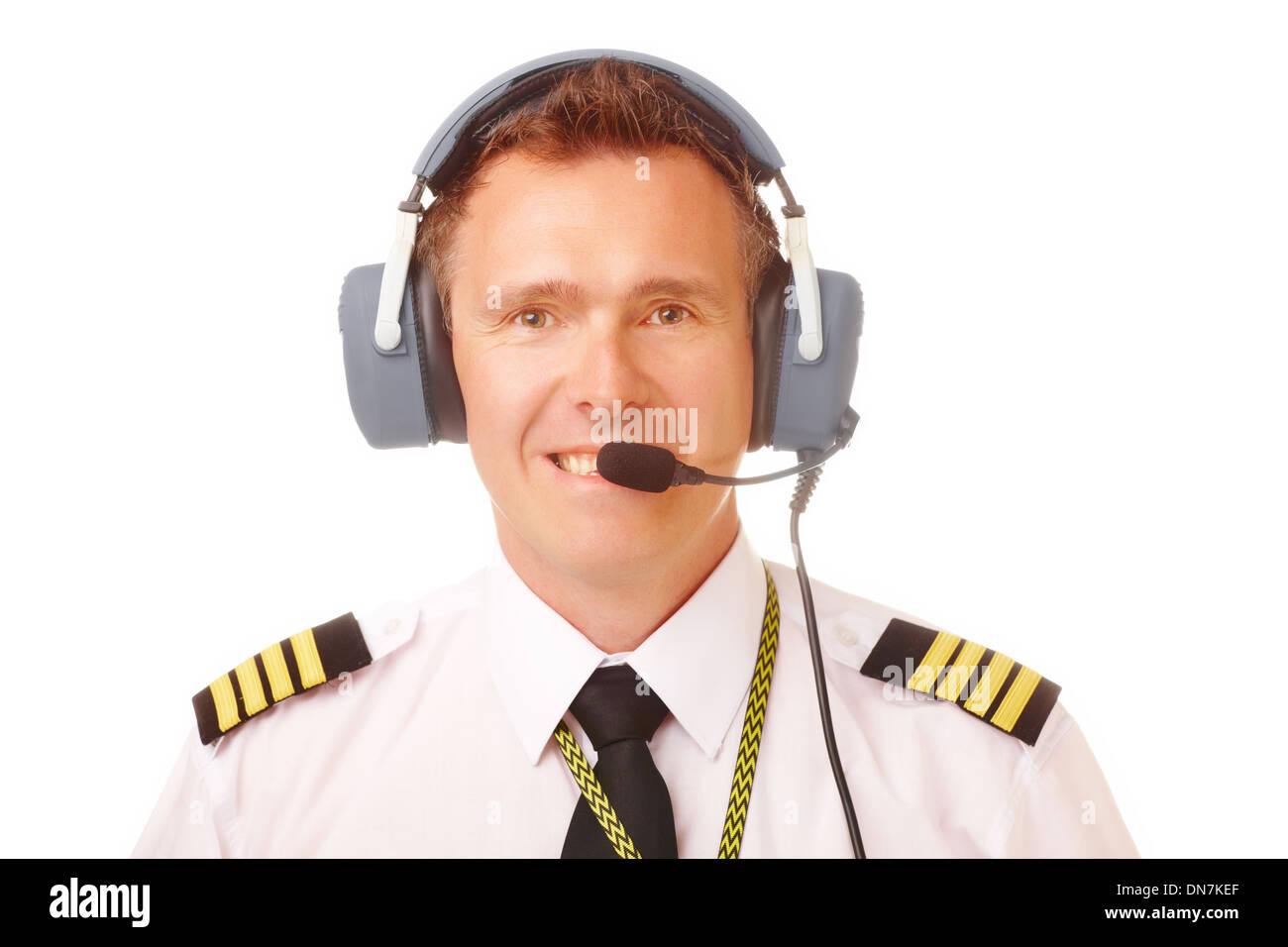 Airline pilot wearing uniform with epaulettes and professional headset