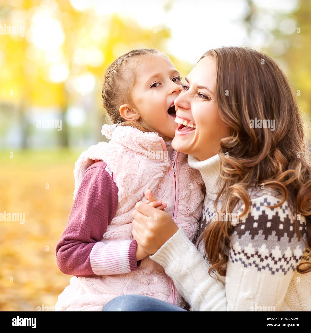 Young mother and her toddler girl have fun in autumn Stock Photo - Alamy