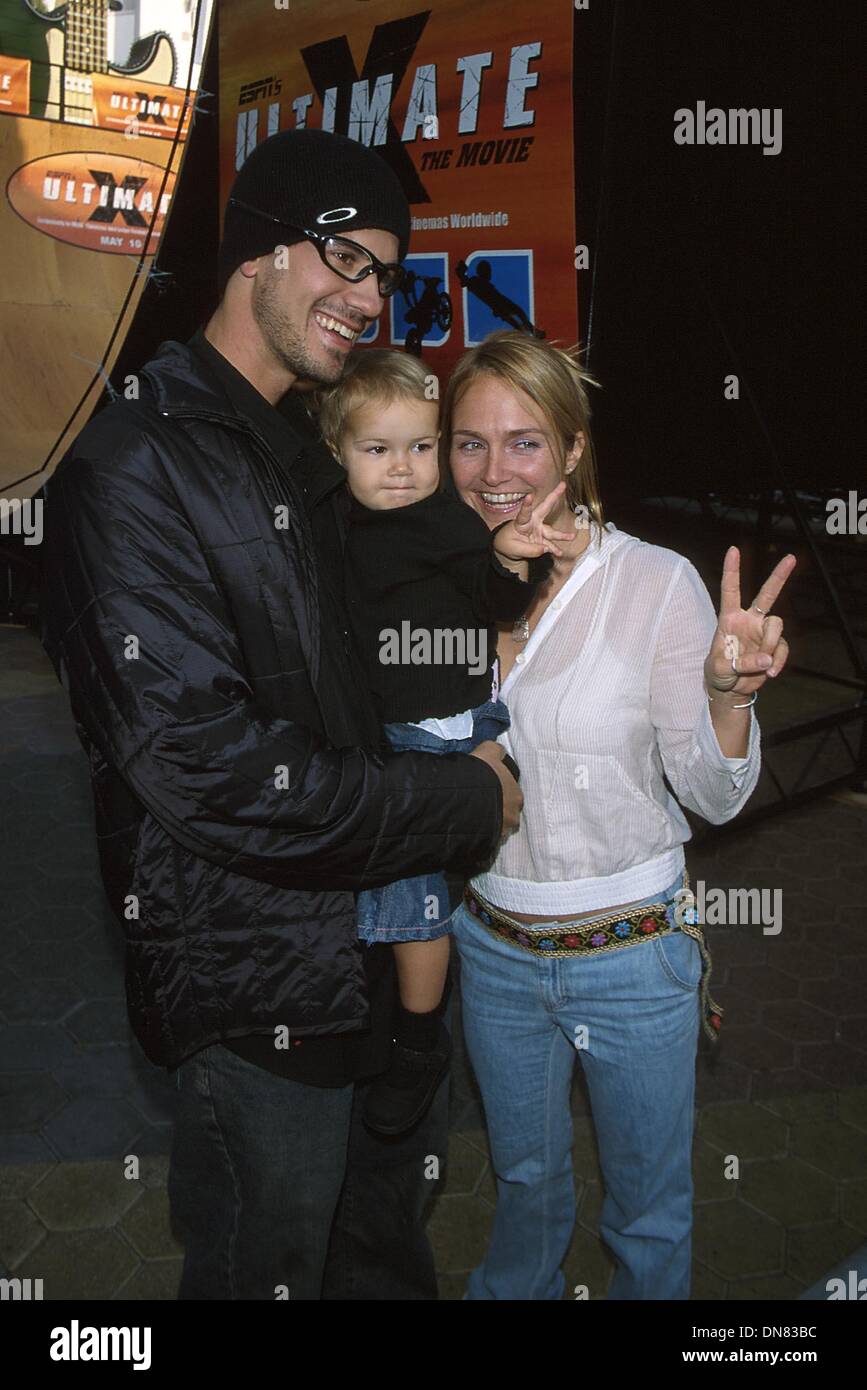 May 7, 2002 - Hollywood, CA, USA - K2494MR: ESPN'S UNTIMATE X, THE MOVIE PREMIERE.IMAX THEATRE, UNIVERSAL  Hollywood, CA 05/06/2002.BOB BURNQUIST (VERY BEST TRICK) AND WIFE JENNIFER WITH DAUGHTER LOTUS . MILAN RYBA/   2002(Credit Image: © Globe Photos/ZUMAPRESS.com) Stock Photo