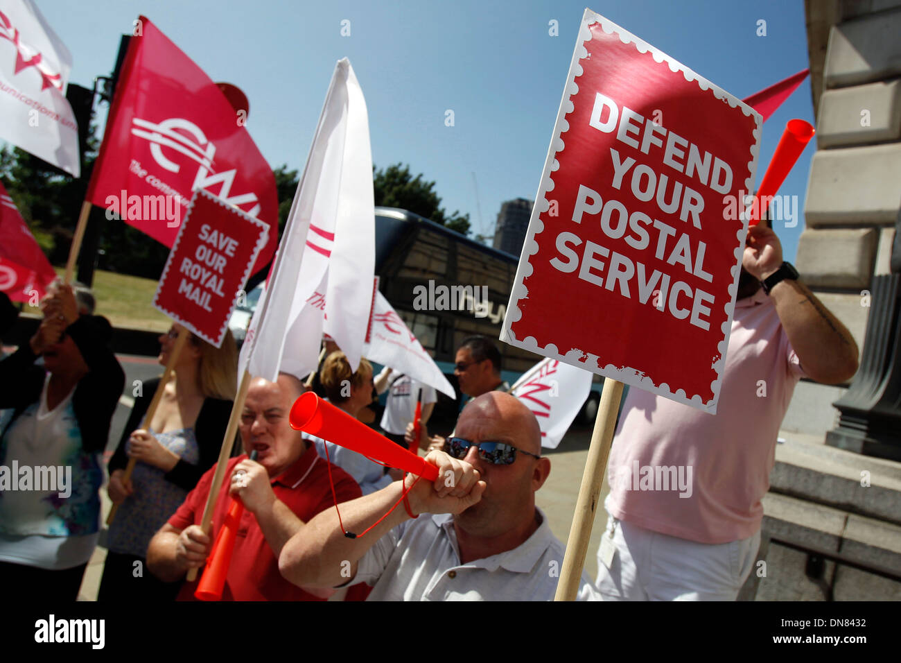 Postal workers and campaigners from the Communication Workers Union protest outside the Royal Mail headquarters Stock Photo