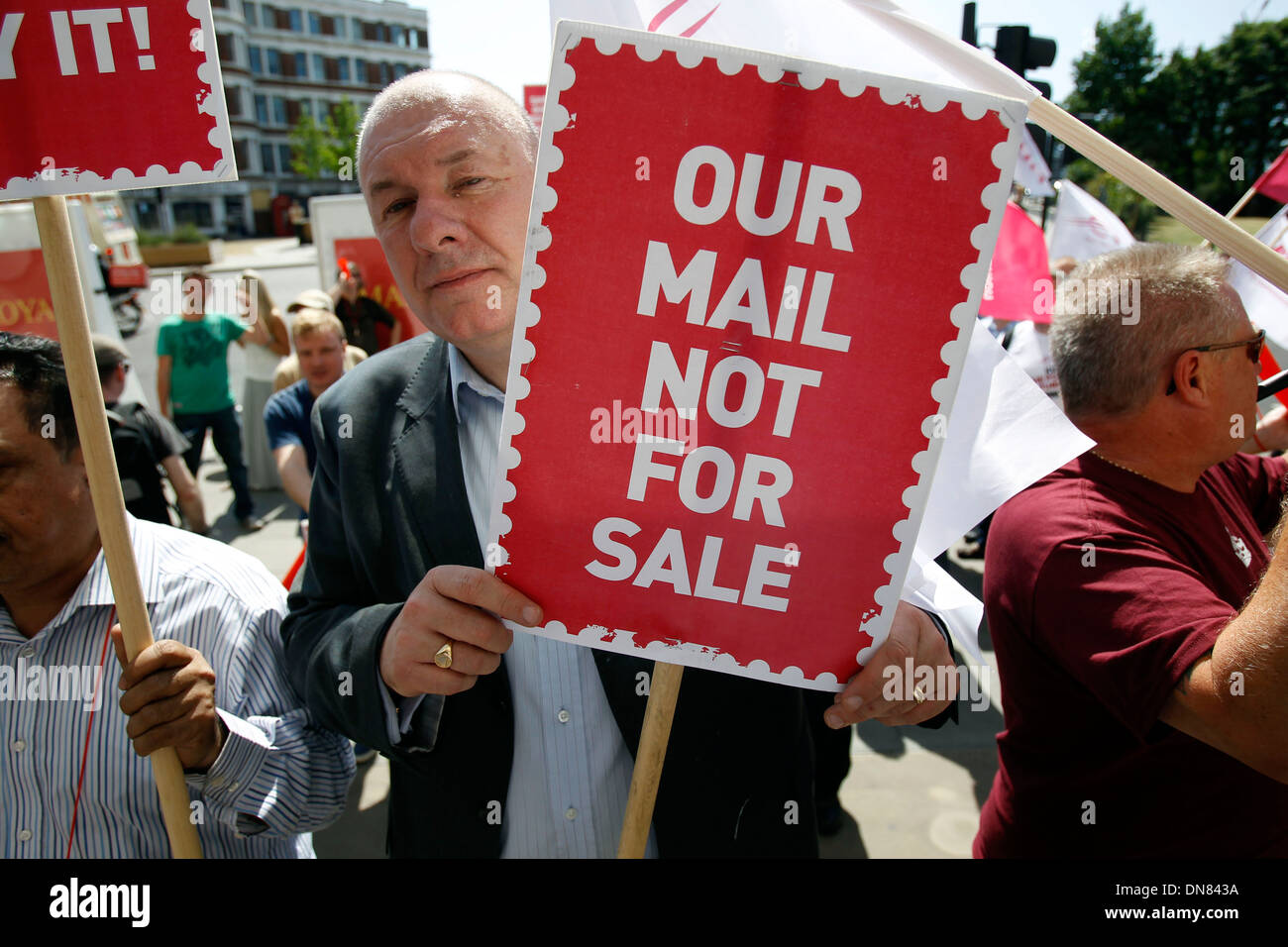 Postal workers and campaigners from the Communication Workers Union protest outside the Royal Mail headquarters Stock Photo
