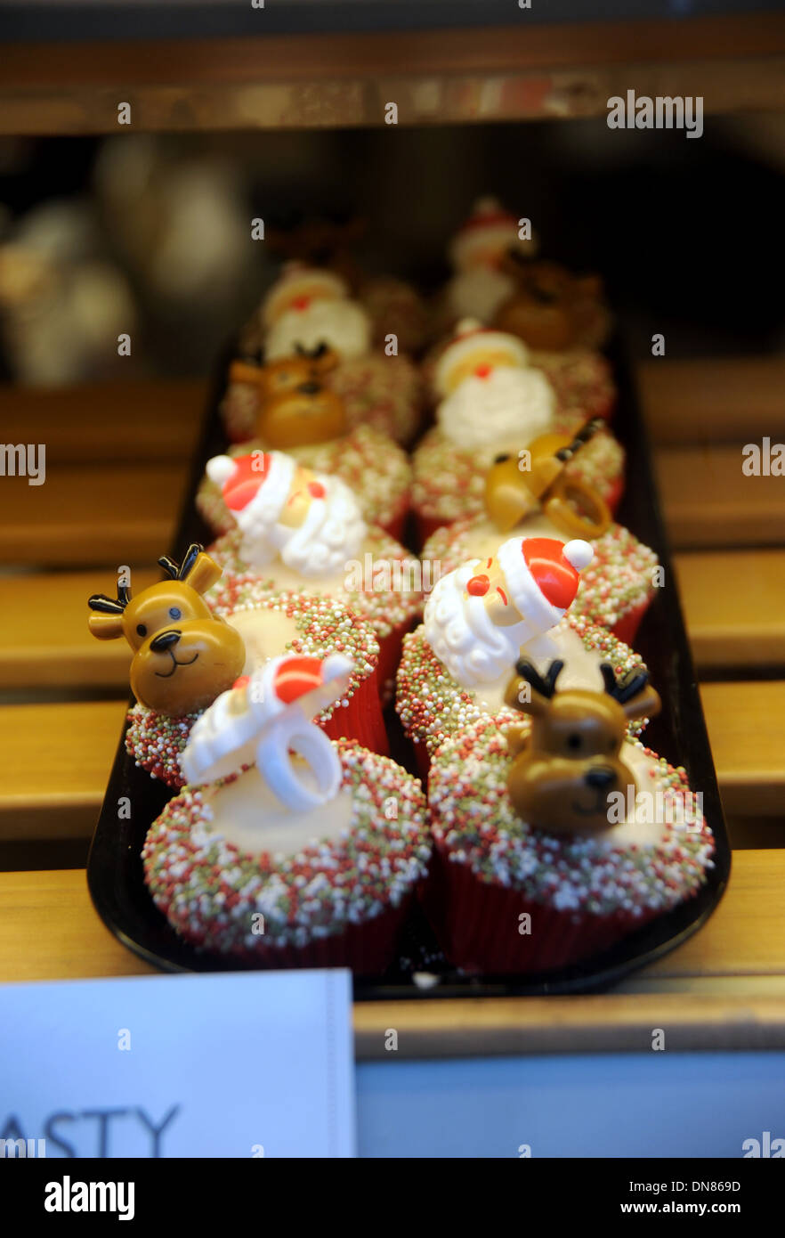 Christmas themed festive cupcakes in Greggs the Bakers shop window Brighton UK Stock Photo