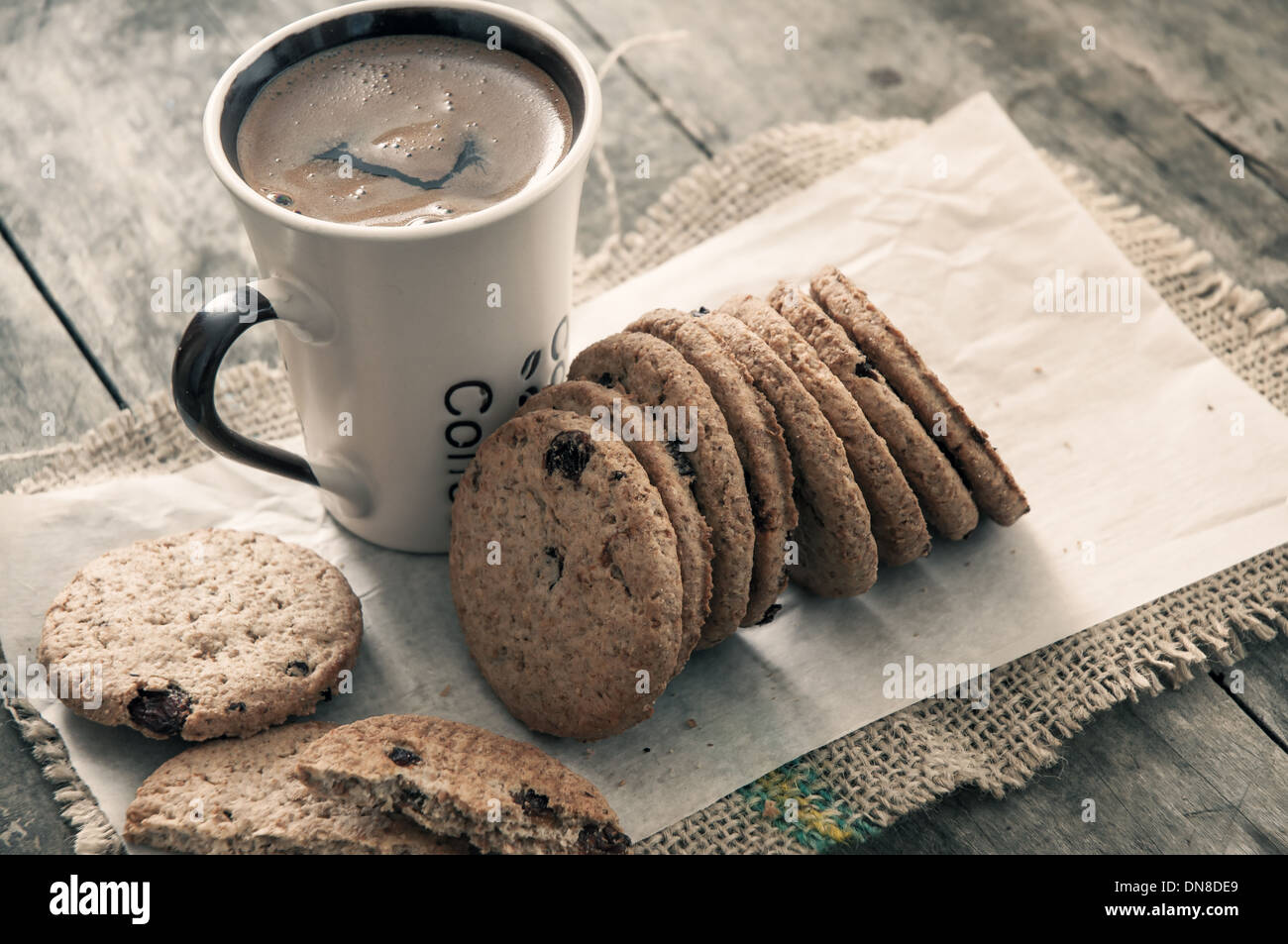 cookies and coffee on old wooden table, close up Stock Photo