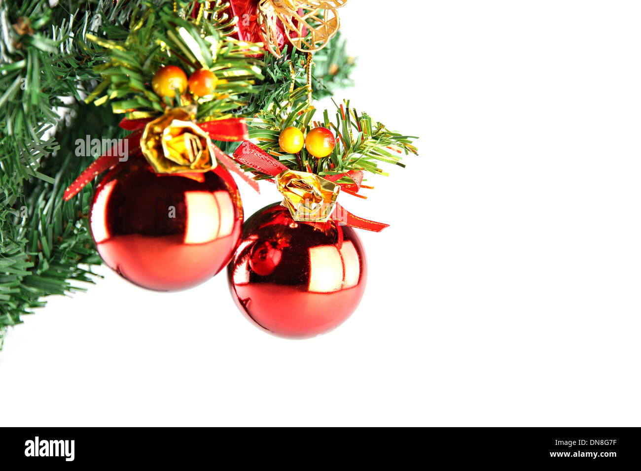Two Red ball hanging on branch of Christmas tree Stock Photo - Alamy