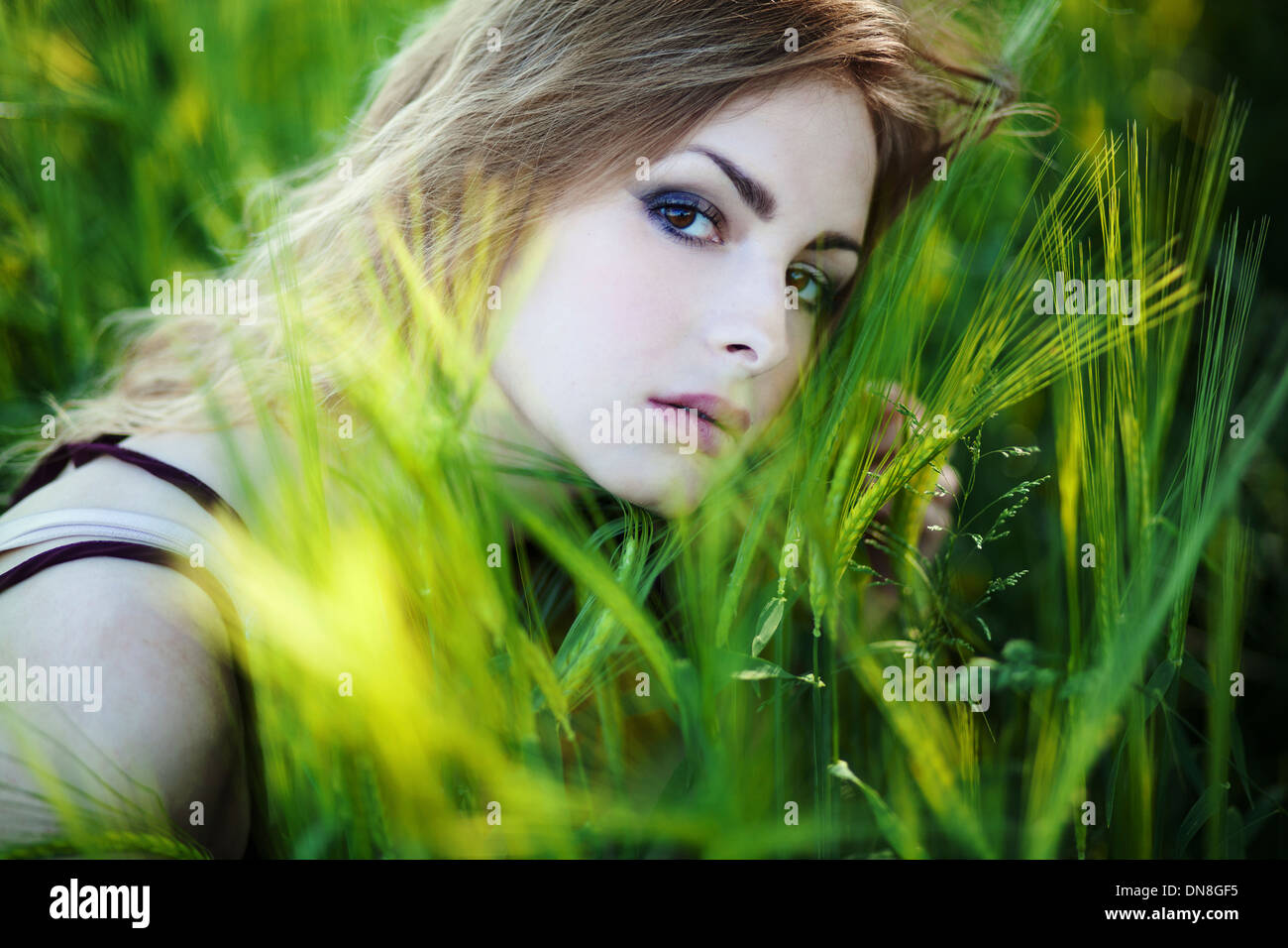 Portrait of young woman looking at camera Stock Photo - Alamy