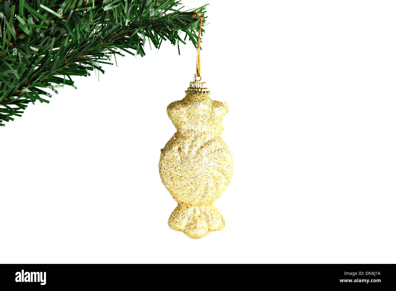 The Picture Golden candy hanging on branch Christmas tree. Stock Photo