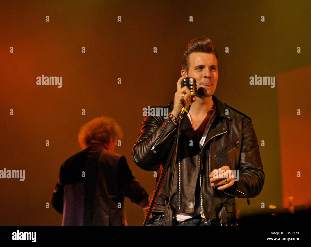 Berlin, Germany. 19th Dec, 2013. Lead singer Sven Budja of the Berlin  Rock'n Roll band 'The Baseballs' performs onstage at the AIDA Night of the  Proms 2013 at the O2-World in Berlin,