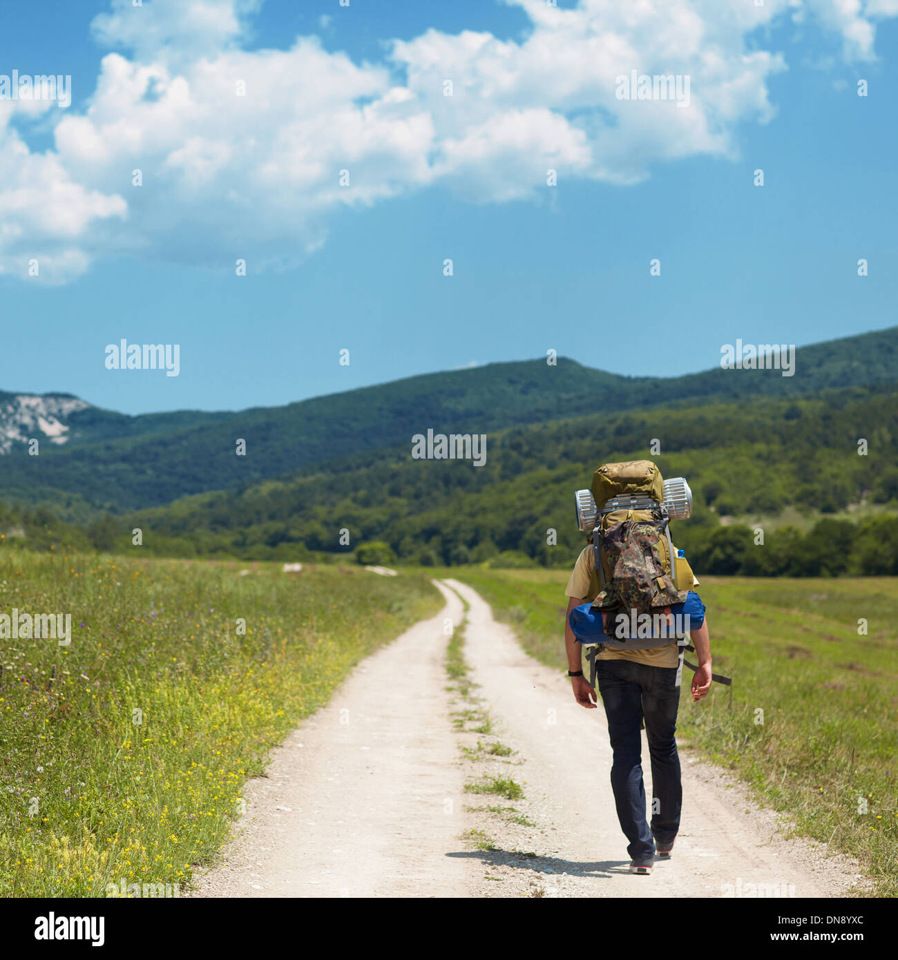 Tourist with a backpack and mountain panorama Stock Photo - Alamy