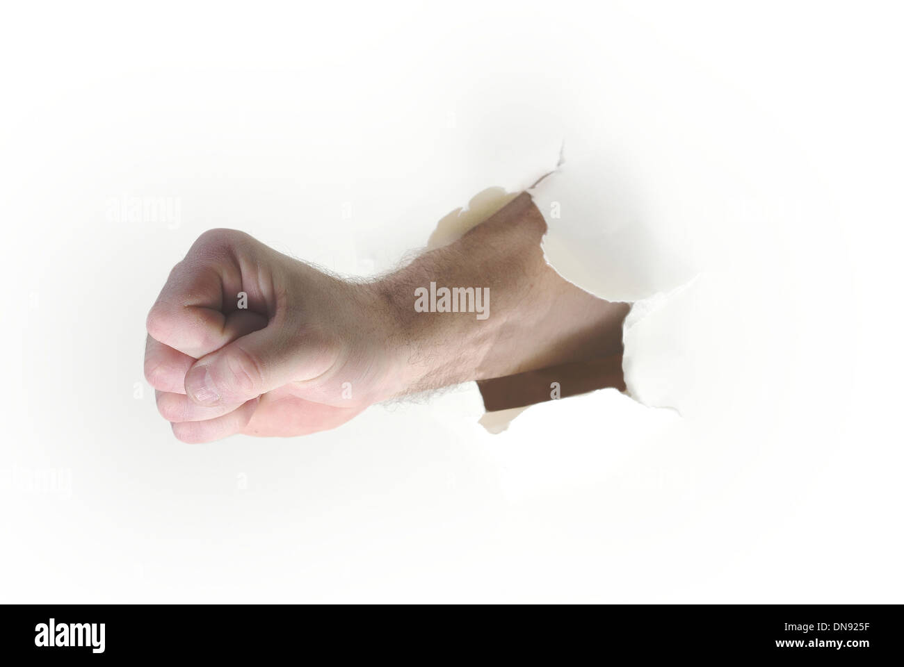 hand punching through paper on white background Stock Photo Alamy