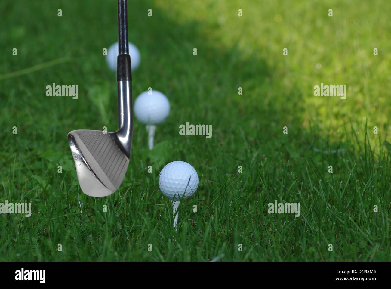 golf stick on moment before hitting in ball Stock Photo