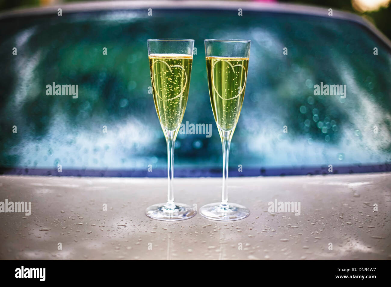 Two glasses of champagne on the car Stock Photo