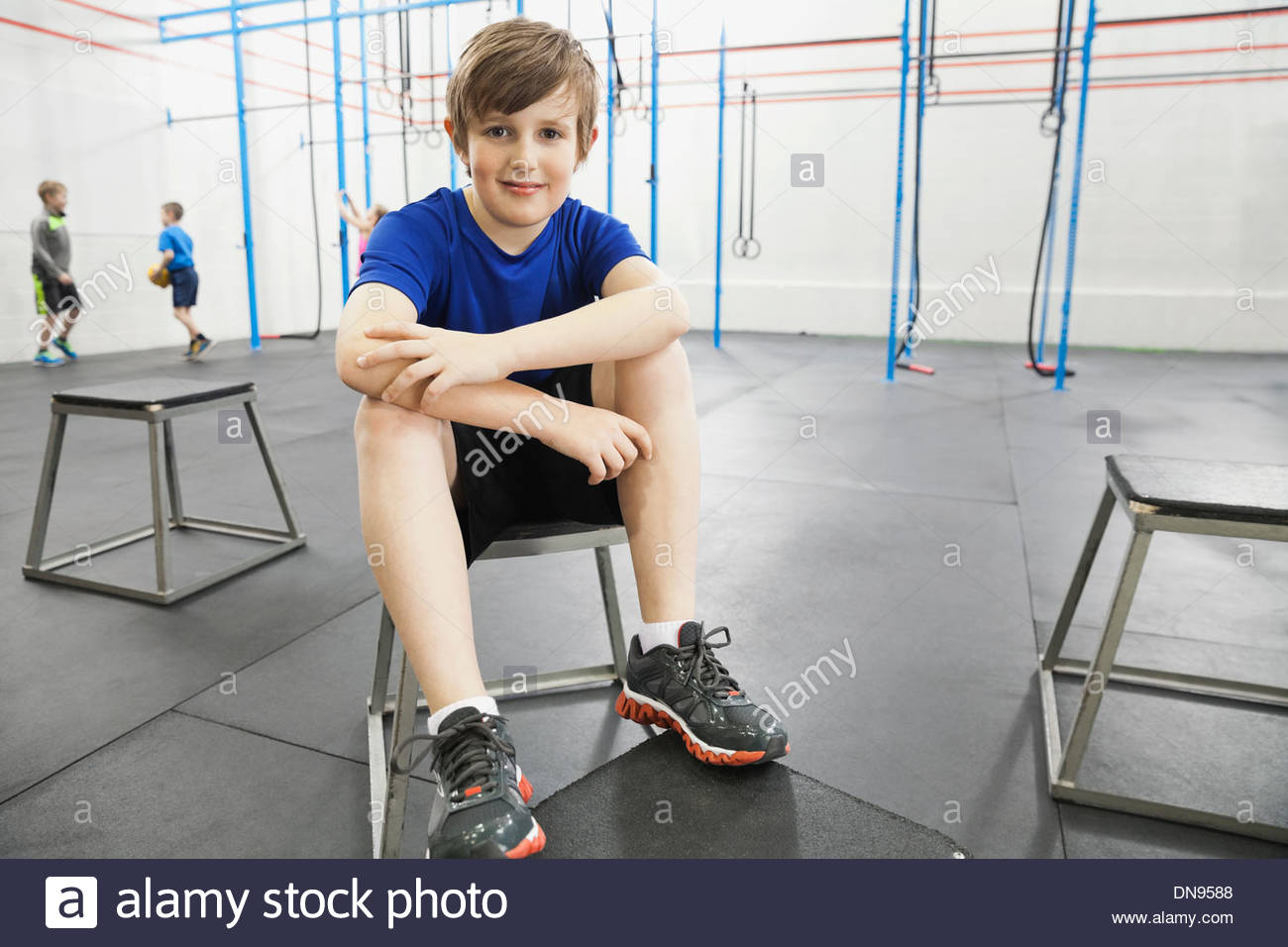 Portrait smiling boy sitting on hi-res stock photography and images - Alamy