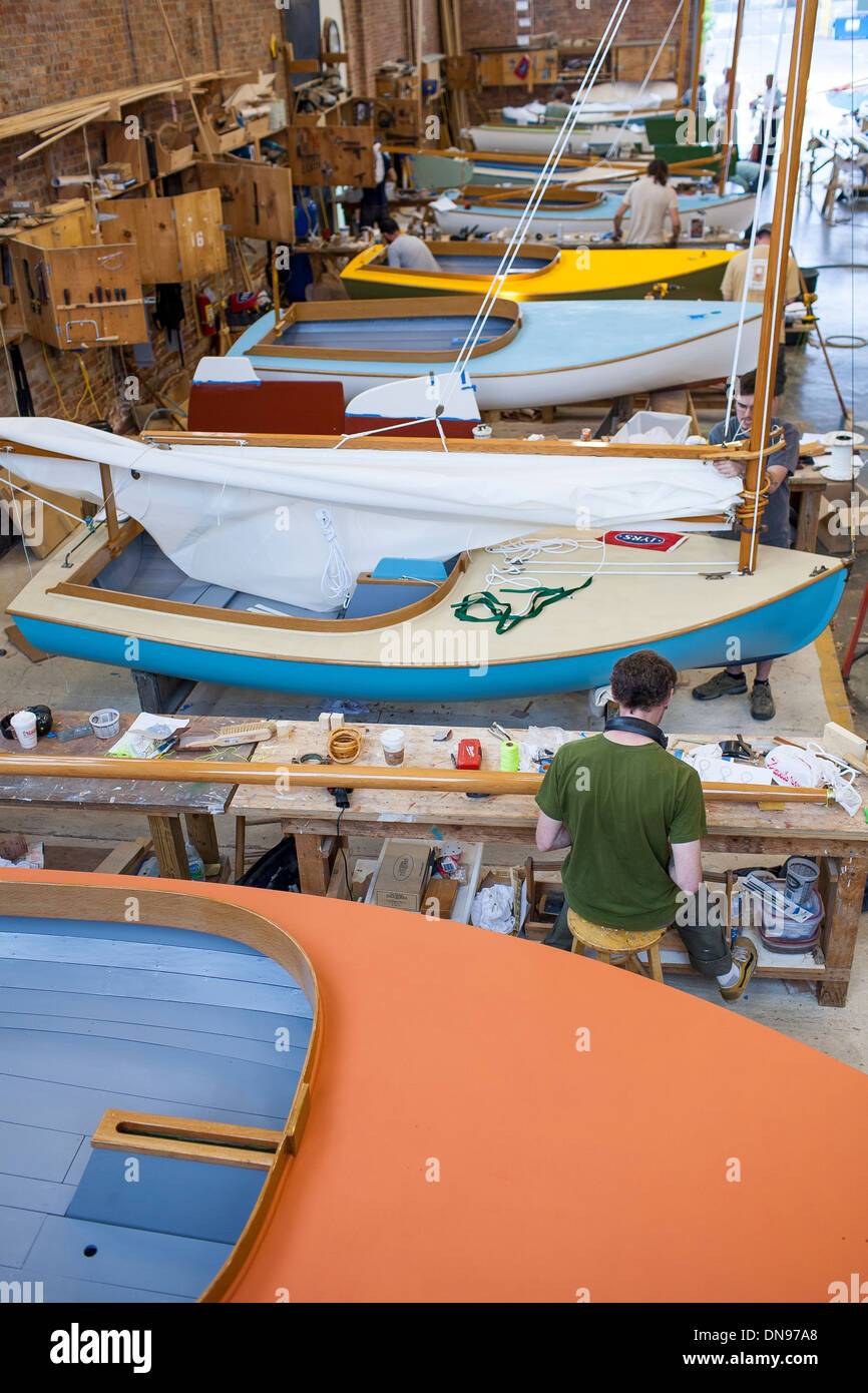 Adding the finishing touches and details to a sailing dinghy at the