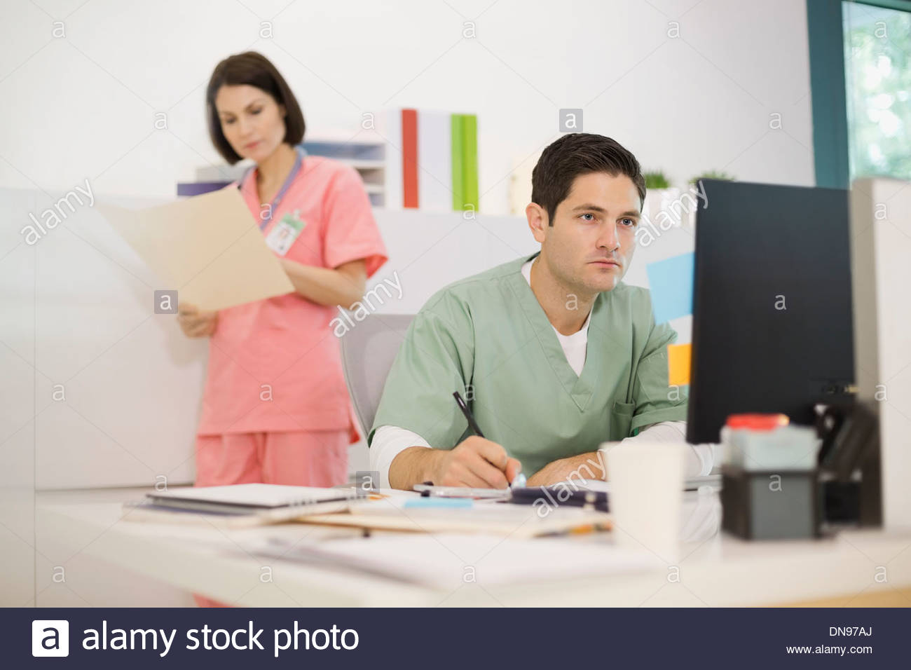Two nurses with notes hi-res stock photography and images - Alamy