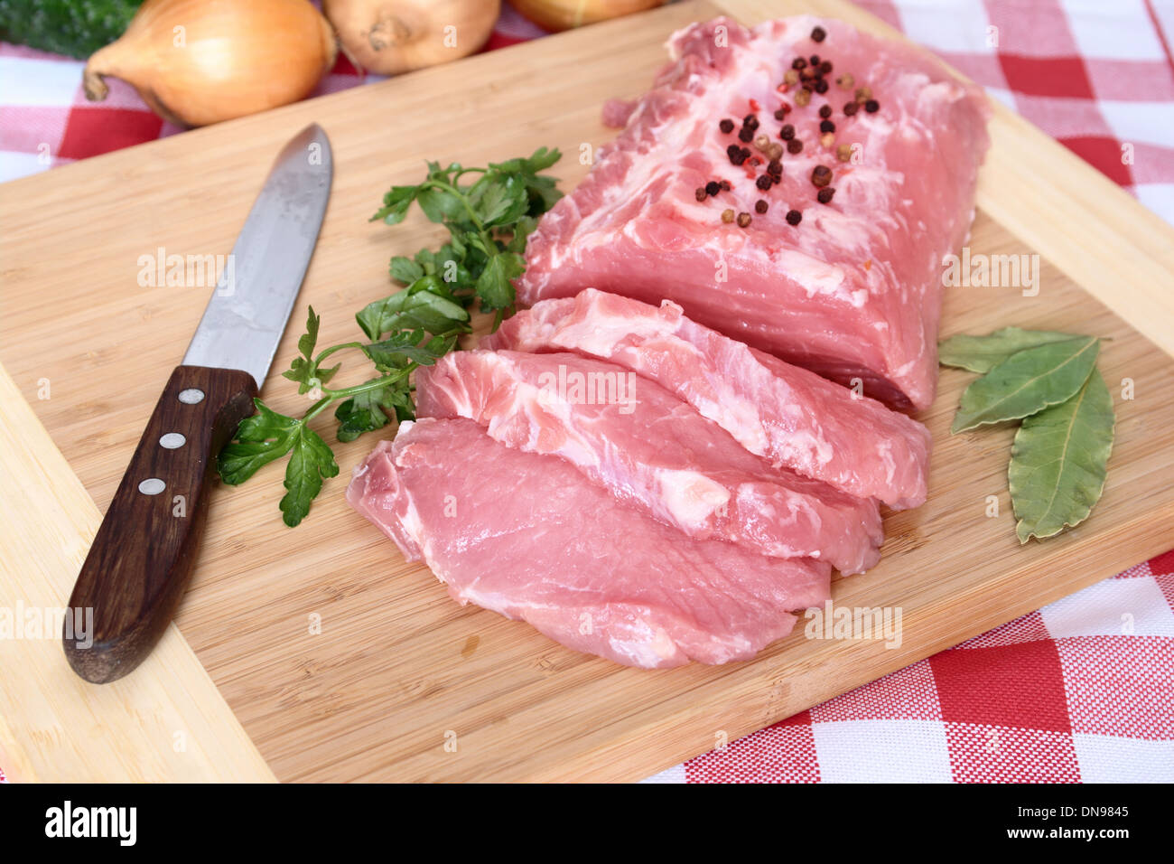 pork chops on board to cutting Stock Photo