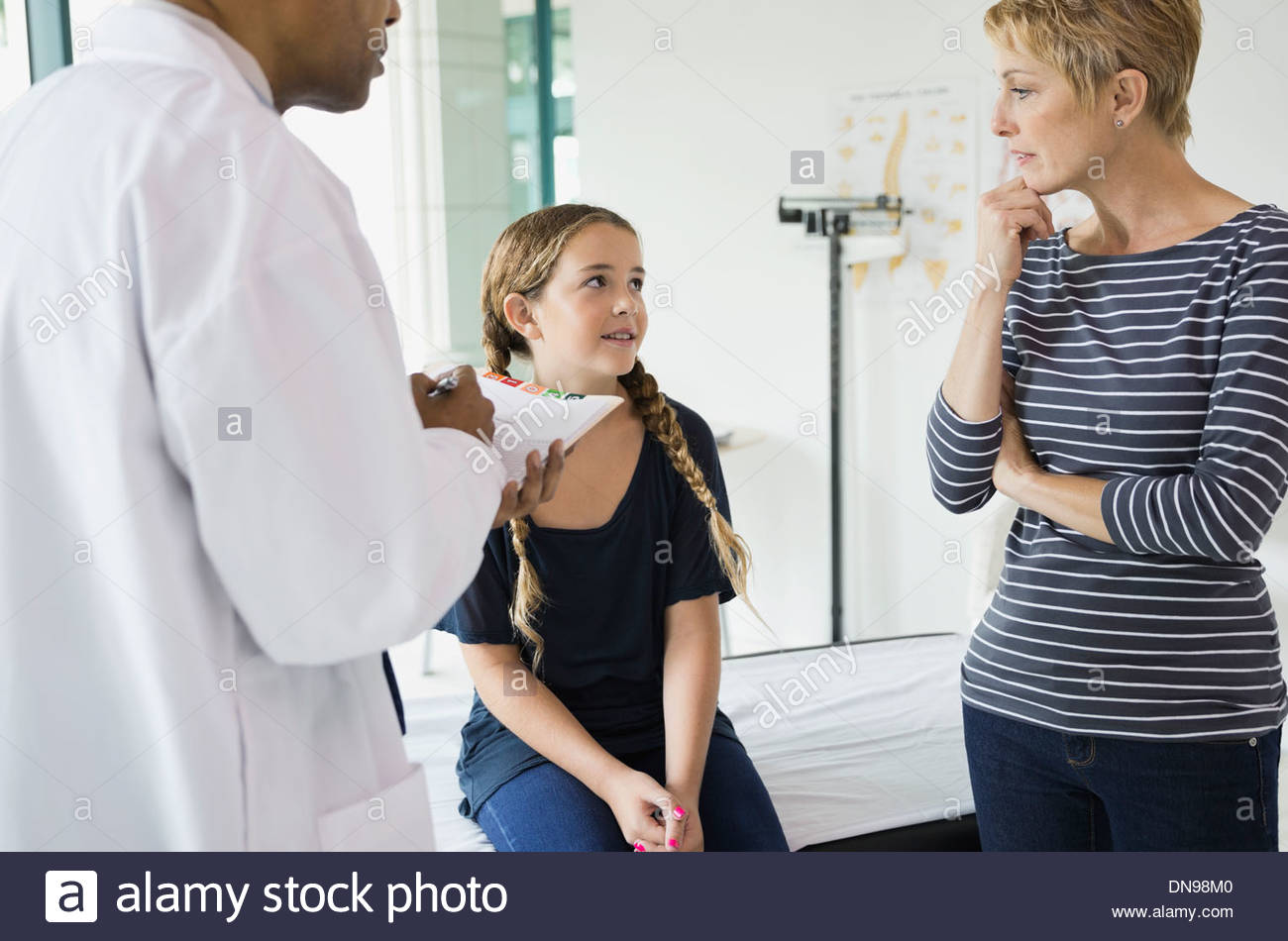 Mother and daughter visiting doctors office Stock Photo