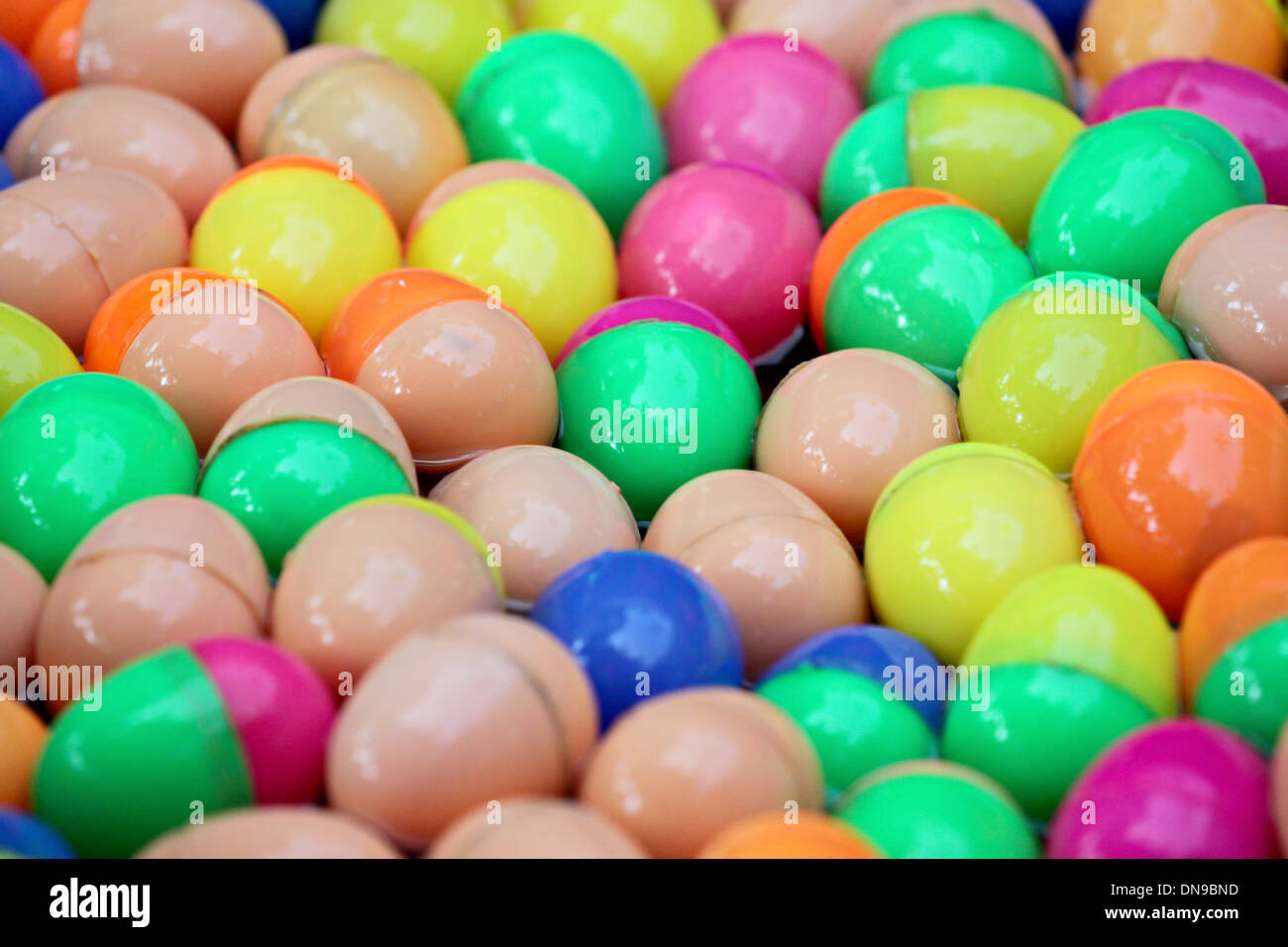 Colorful plastic spheres floating on the water. Stock Photo