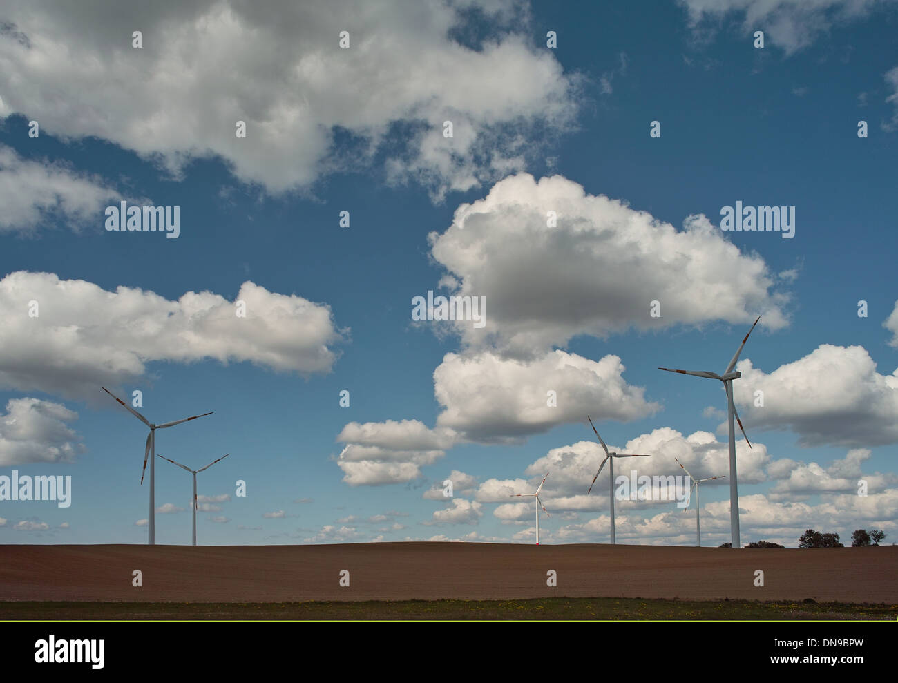 wind turbine on blue sky background Stock Photo - Alamy