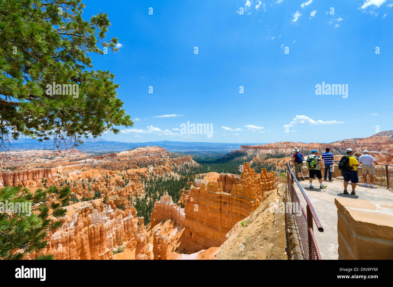 Tourists at an overlook at Sunset Point, Bryce Amphitheater, Bryce Canyon National Park, Utah, USA Stock Photo