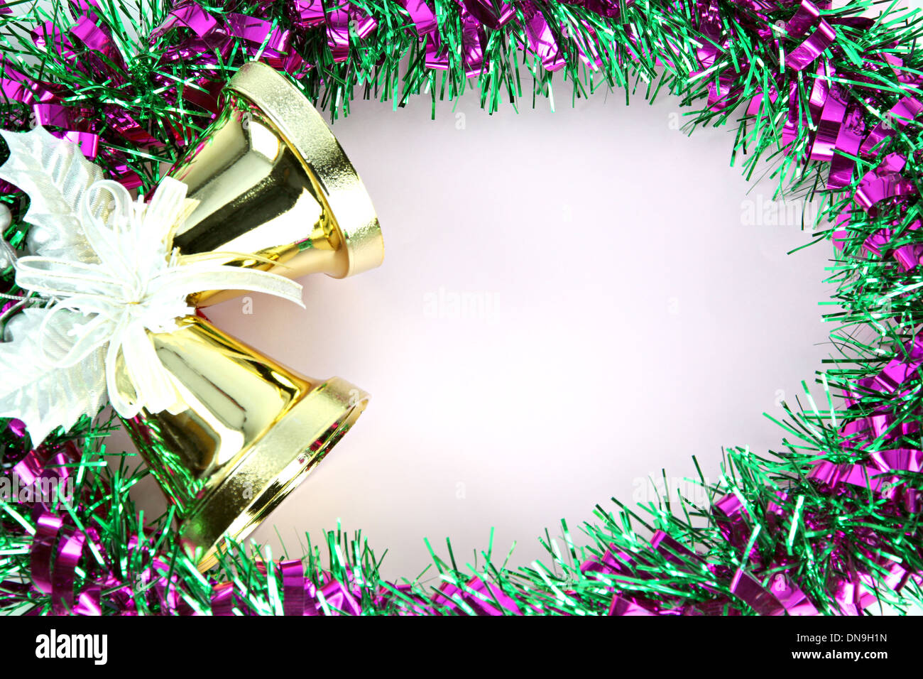 Crispy golden bells and decorations Green ribbon can use it in Christmas and New Year. Stock Photo