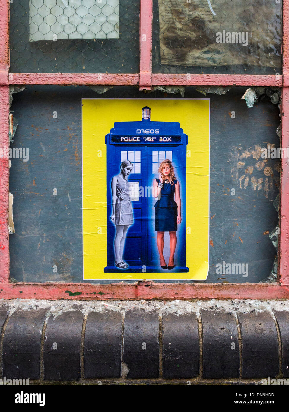 Poster street art D7606 -- Blue police telephone public call box and two women  off Brick Lane, Spitalfields, London Stock Photo