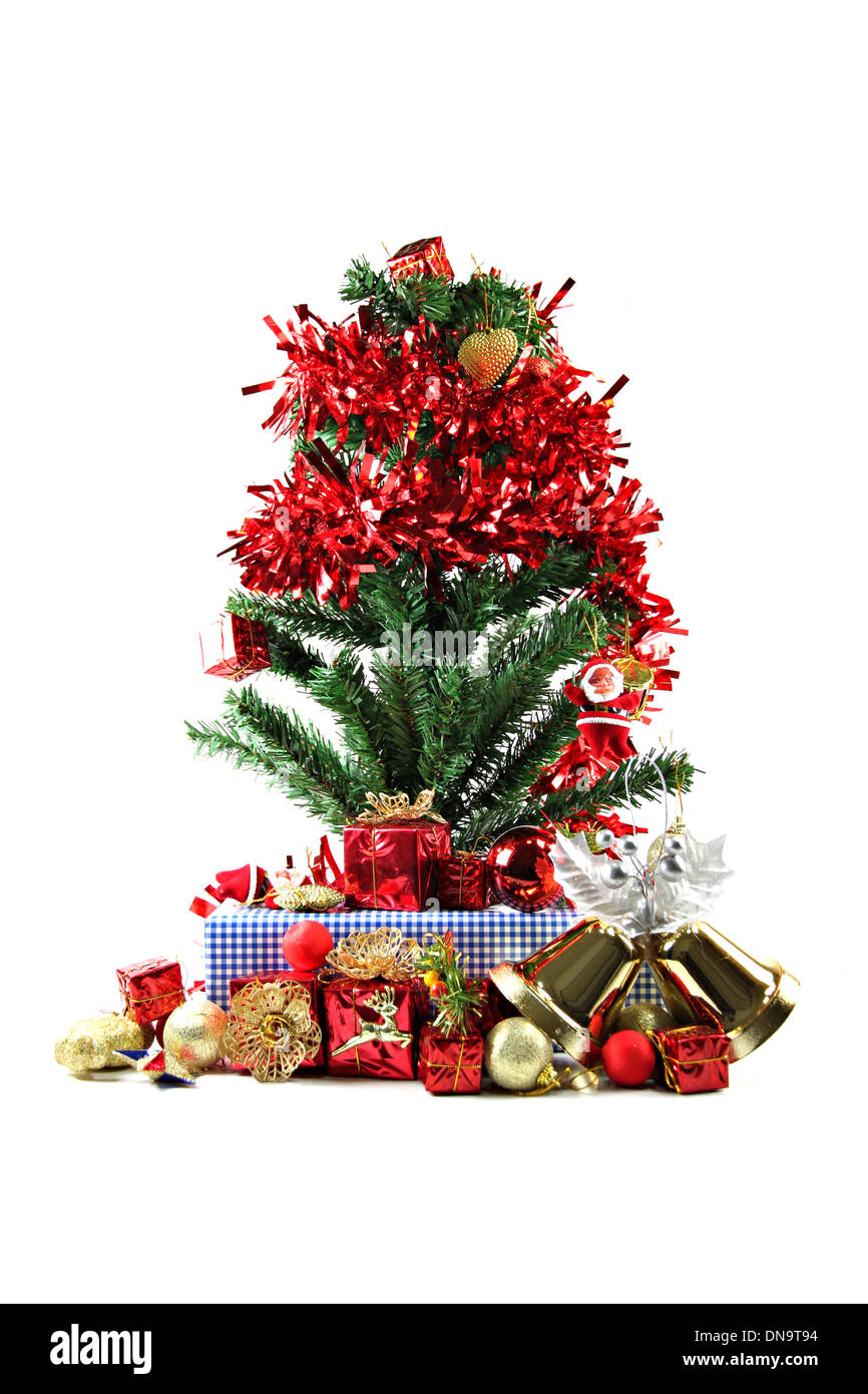 Red ribbon and Christmas trees and accessories with are placed. Stock Photo