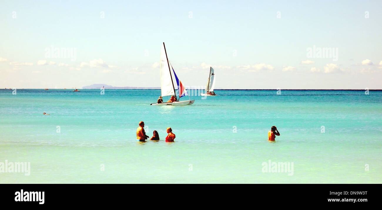 Group of tourists in the Atlantc Ocean in Varadero, Cuba Stock Photo