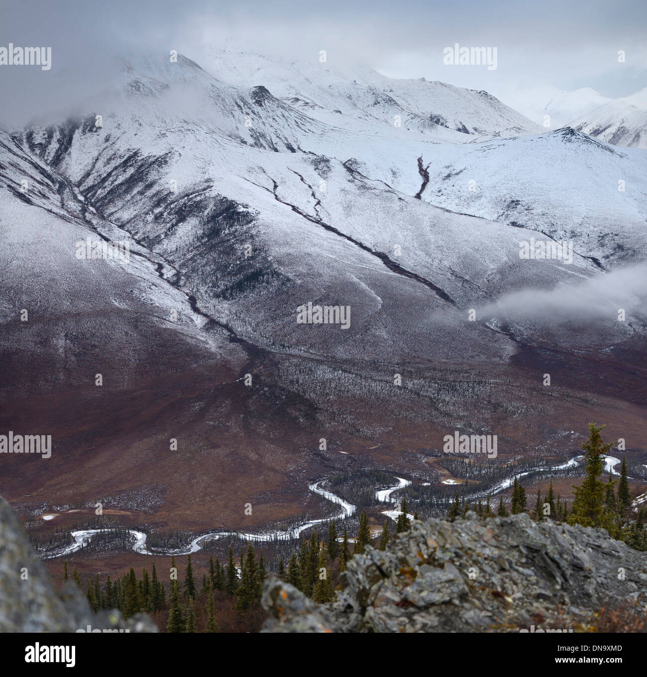 Cliff top view of snow dusted Endicott Mountains Alaska with Wiseman Creek valley Wiseman Alaska USA Stock Photo