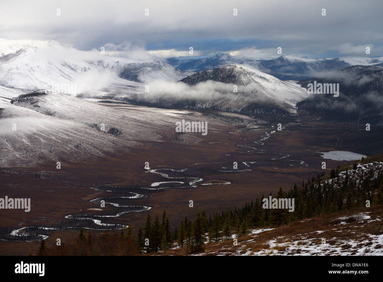 View of snow on Endicott Mountains Alaska with Wiseman Creek valley and Nolan Creek Lake Wiseman Alaska USA Stock Photo