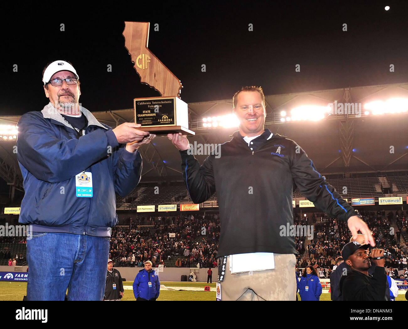 Carson, CA, . 20th Dec, 2013. Bakersfield Drillers head coach Paul Golla with the championship trophy after winning the CIF Division 1 California State Football Championship football game between the Del Oro Golden Eagles and the Bakersfield Drillers at the StubHub Center in Carson, California.The Bakersfield Drillers defeat the Del Oro Golden Eagles 56-26.Louis Lopez/CSM/Alamy Live News Stock Photo