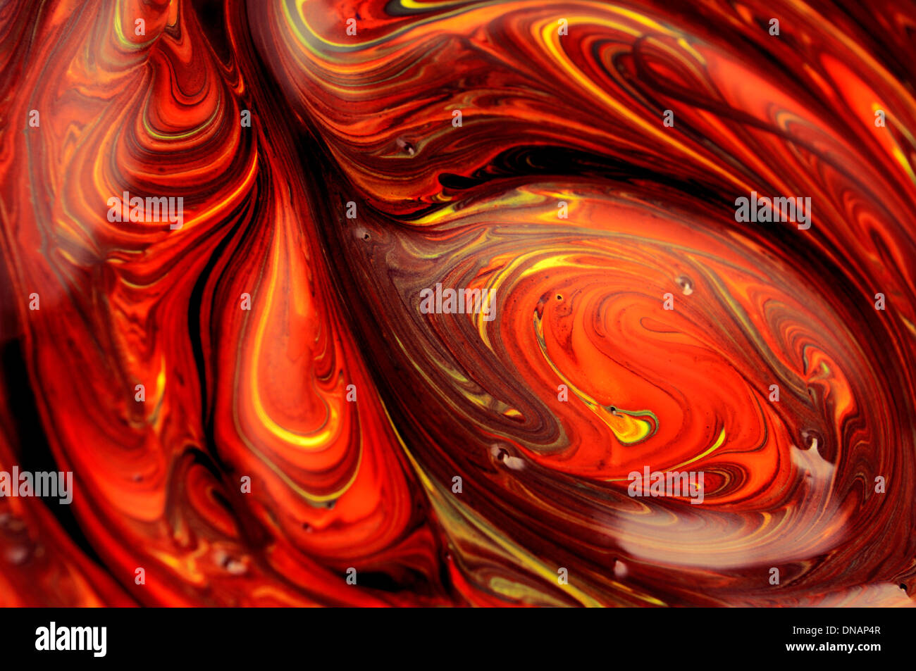 Abstract art work with smeared red orange paint and digital processing Stock Photo