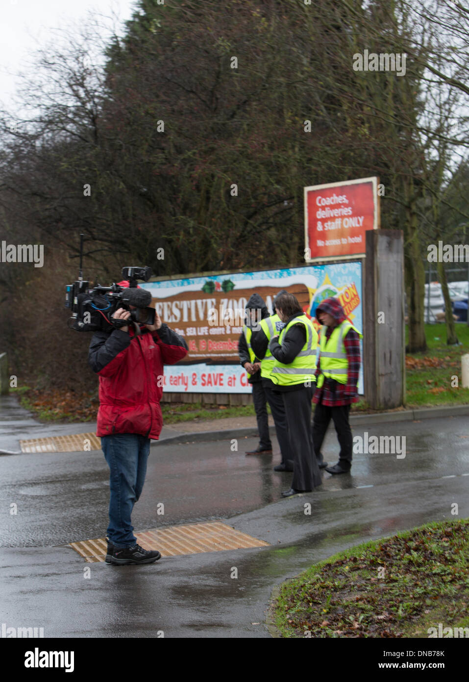 Chessington, Surrey, UK. 21st Dec 2013.  Security and television news crews at the entrance to Chessington World of Adventure after a fire reported on the news to be in the cafe. Credit:  Colin Hutchings/Alamy Live News Stock Photo