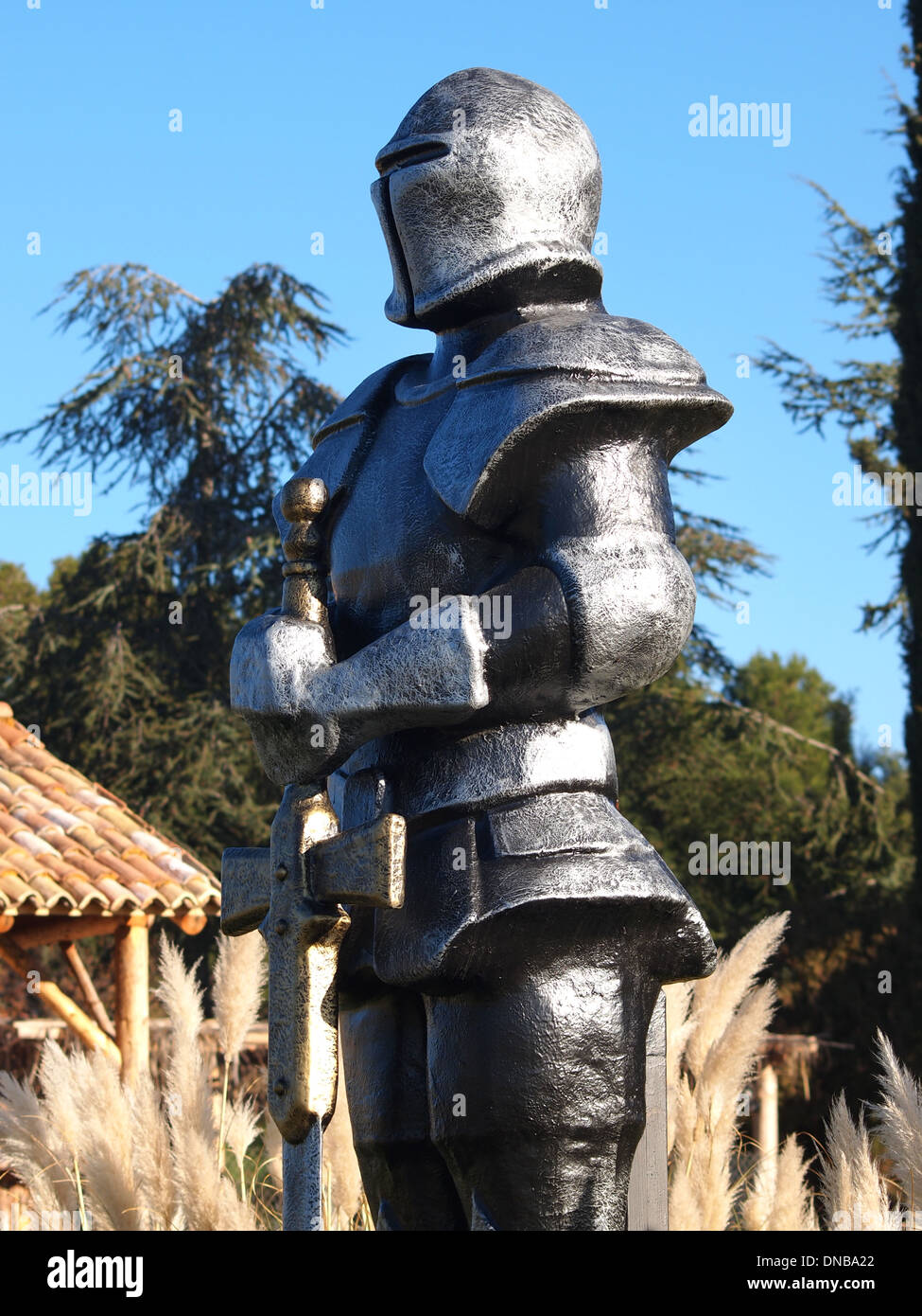 statue of Knight Swordsman in Full Armour Stock Photo