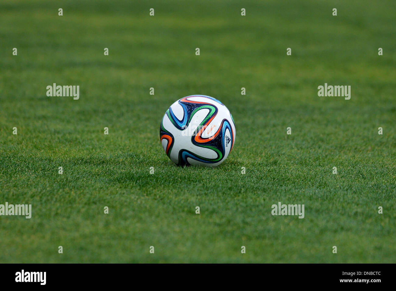Agadir, Morocco. 20th Dec, 2013. The new World Cup ball Brazuca from Adidas during an FC Bayern Munich training session at the stadium 'Stade Adrar' in Agadir, Morocco, 20 December 2013. FC Bayern Munich will play in the semi-final of the Club World Cup in Agadir on 21 December 2013. Photo: DAVID EBENER/dpa/Alamy Live News Stock Photo