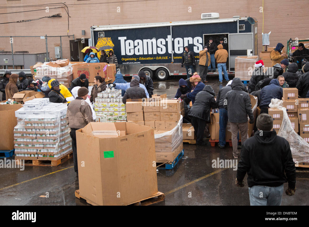 Detroit, Michigan, USA In a cold rain, volunteers from local trade